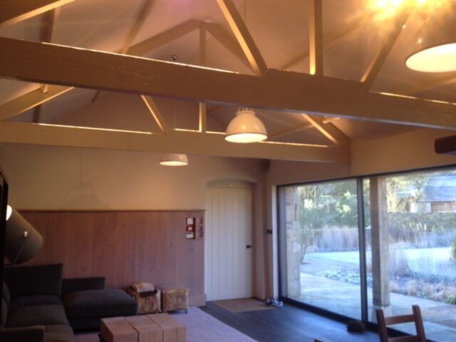 Decorative lighting in a restored pool house, Gloucestershire